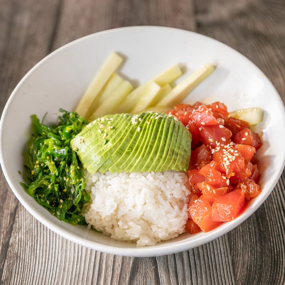 Vinsar's Lounge Asian-fusion poke bowl with tuna, avocado, seaweed salad, and rice.